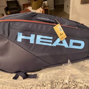 Head Navy Tennis Racket Bag with Light Blue Logo and Orange Trim